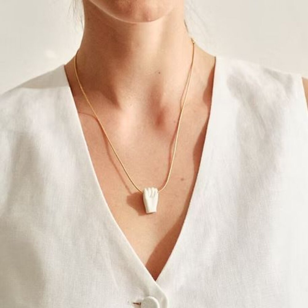 Andres Gallardo fist pendant necklace